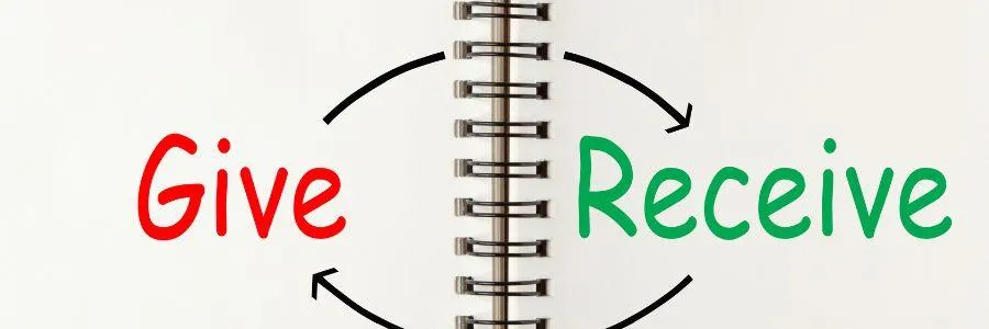 A notebook showing the words “Give” and “Receive” connected by arrows, representing how giving back strengthens mental strength.