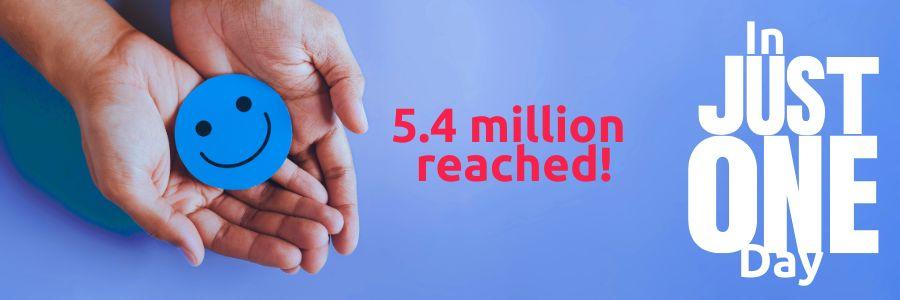 Hands holding a blue smiley face button beside red text reading “5.4 million reached” and white text “In Just One Day,” illustrating the global Giving Results from Do1Give Day.