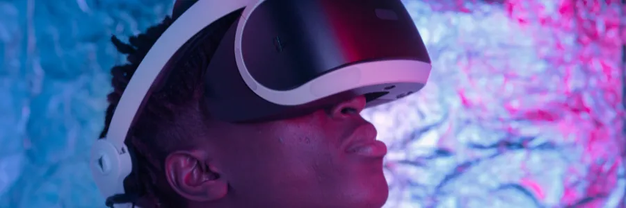 A young person using a VR headset, symbolizing AI innovations shaping the future of learning and creativity.