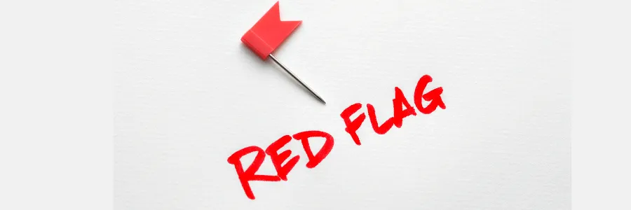 Small red flag pin next to the words “RED FLAG,” symbolizing how saying “I’m Fine” can be a big red flag for emotional wellbeing.