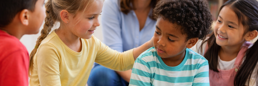 Kids practicing empathy in a classroom—building Human Skills and rising skills through emotional understanding and support.