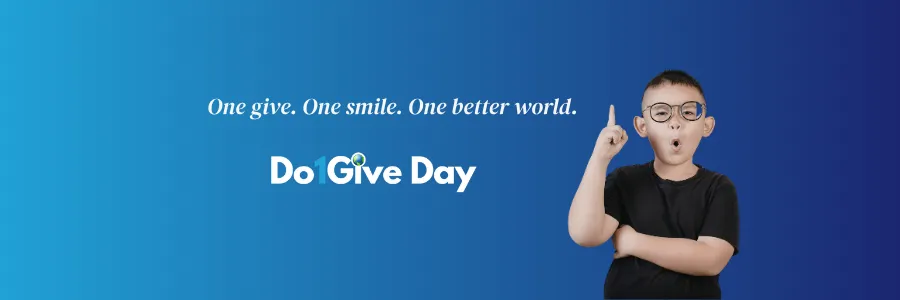 A young boy wearing glasses points his finger up with a thoughtful expression against a blue gradient background, beside the Do1Give Day logo and the tagline "One give. One smile. One better world."