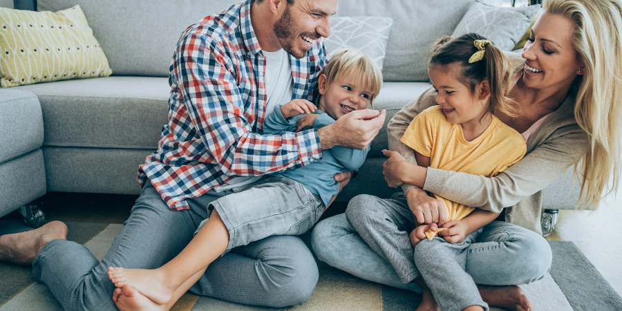 Happy family spending quality time together at home, laughing and strengthening their family connection